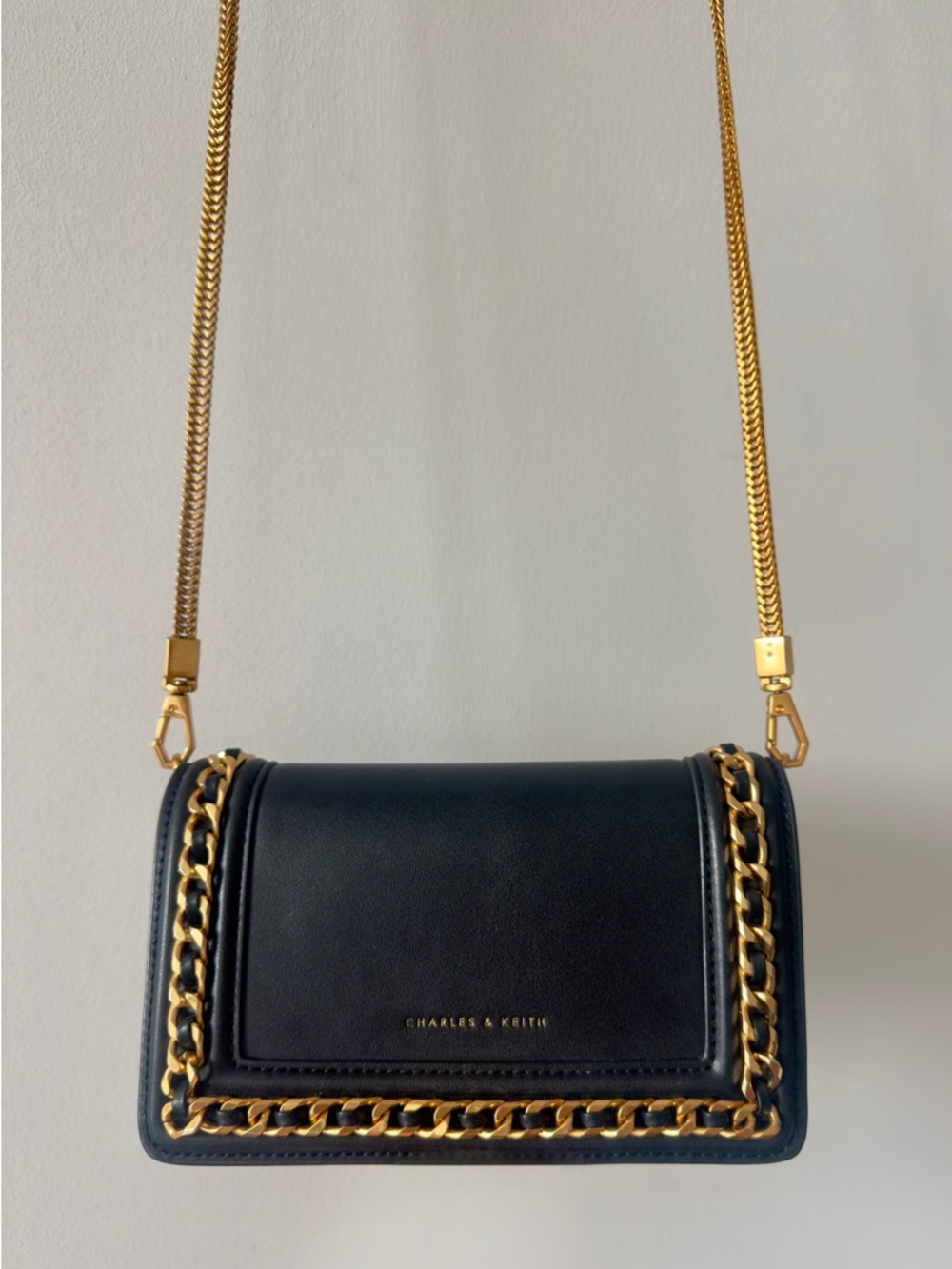 Charles & Keith Black Crossbody Bag with Gold Chain Trim
